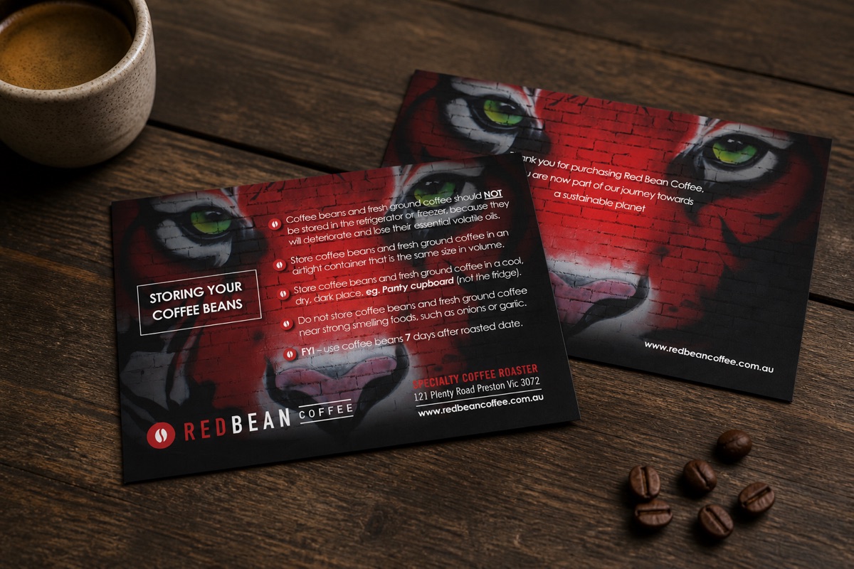 Red Bean Coffee A6 postcards printed on uncoated card and photographed in a café setting